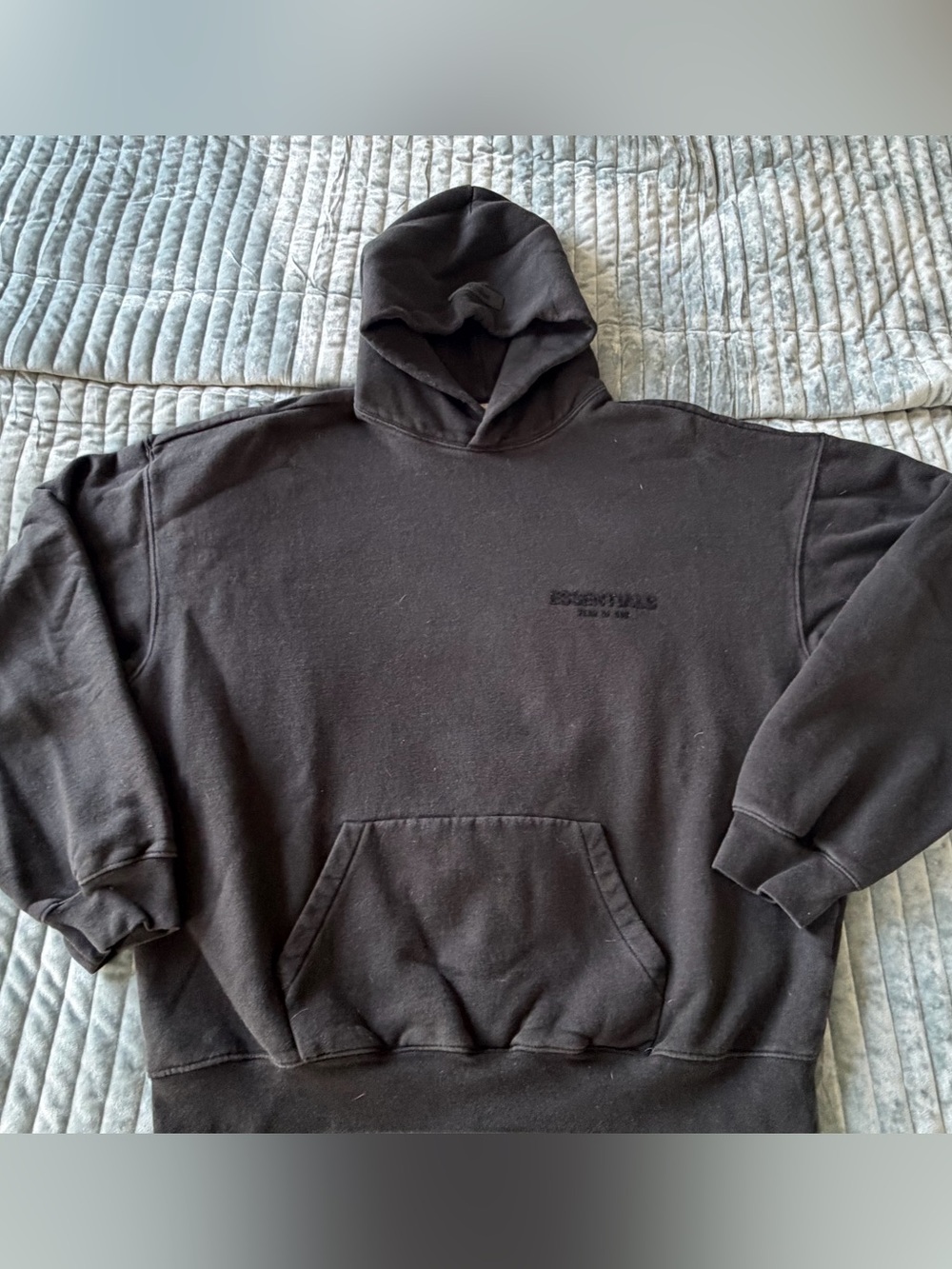 Essentials Black Pullover Hoodie with Subtle Chest Logo